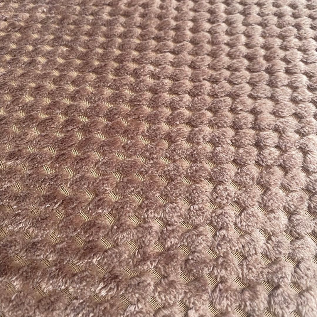 Medium brown polka dot bedspread